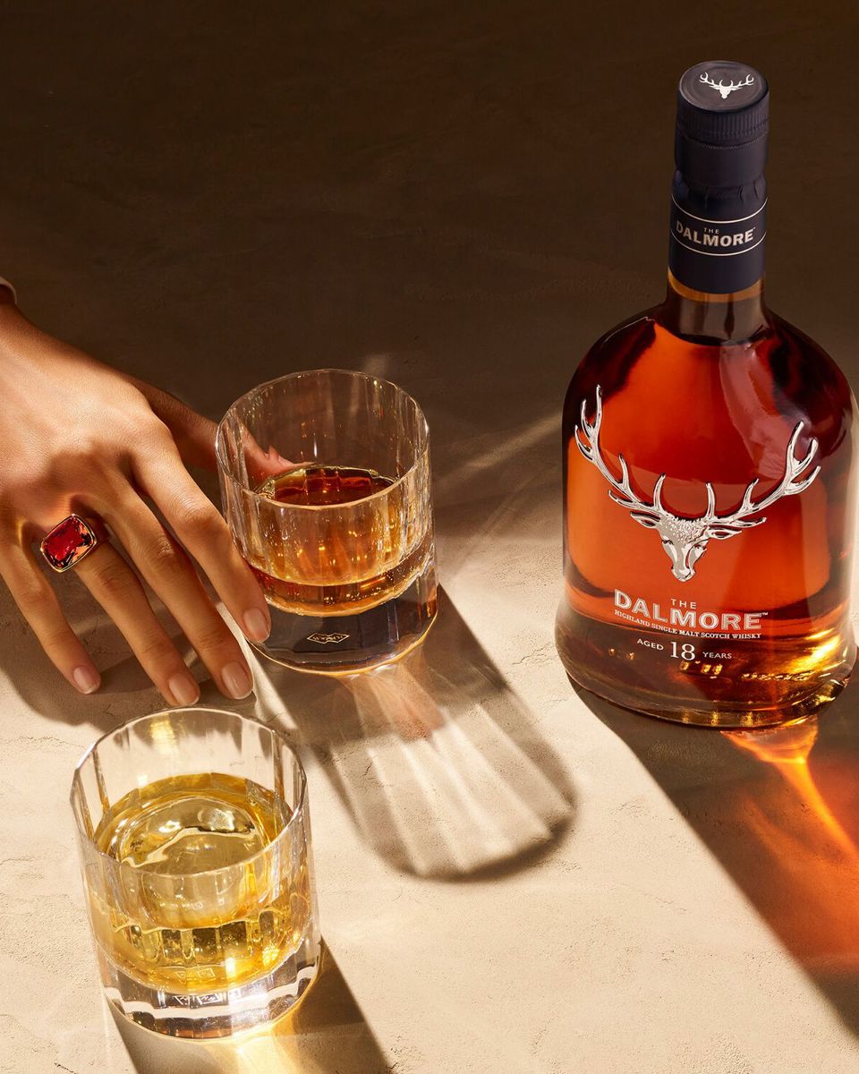 The Dalmore 18 Year old with hand and glasses